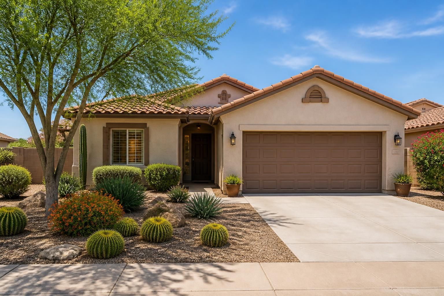 Mesa home exterior with tidy landscaping and garage frontage.